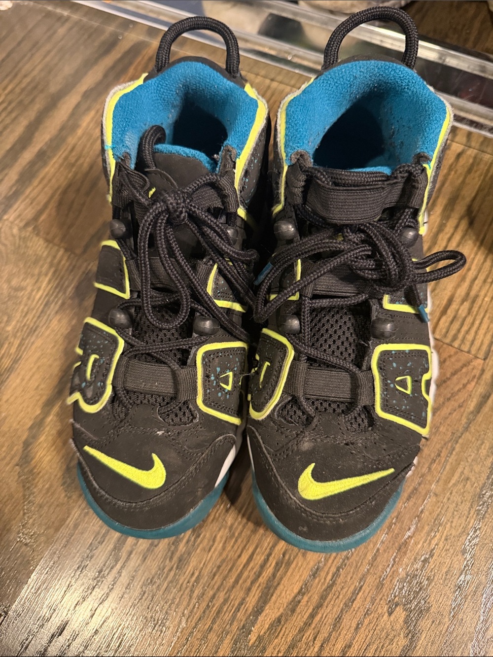 Nike Kids Black Sneakers with Neon Yellow Accents and Blue Lining
